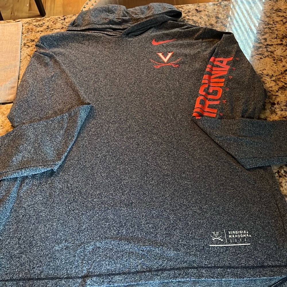 Mens size large Nike Hoodie, 50% cotton and 50% polyester.